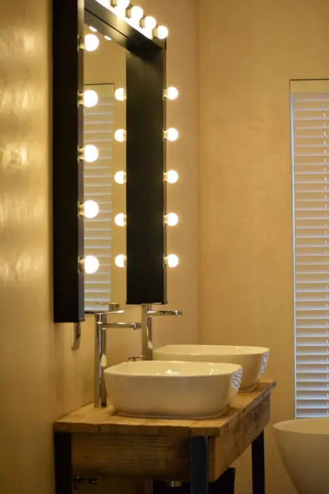 Vanity with a lit dressing-room mirror