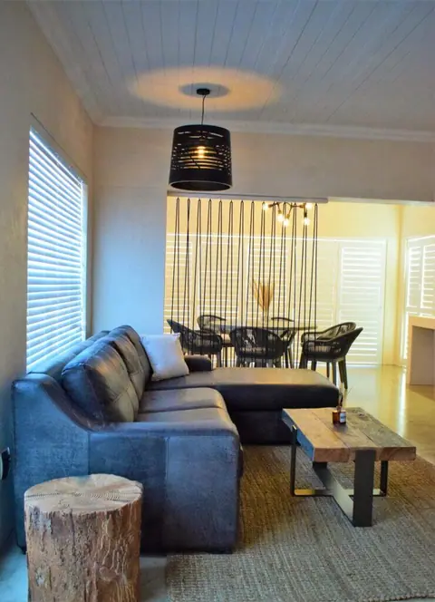 Open-plan lounge with a corner sofa and dining area