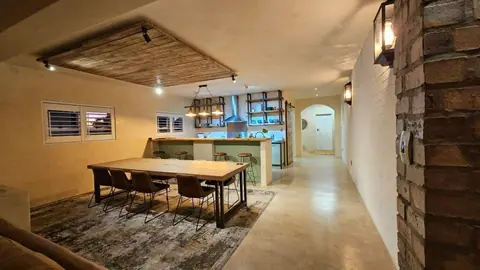 Open-plan dining area leading to the kitchen